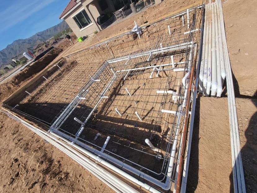 Pool steel reinforcement and plumbing during construction
